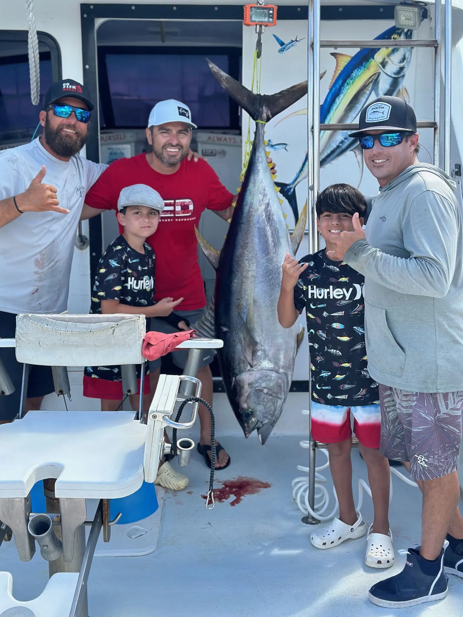 Group of friends on a private fishing charter in Kauai